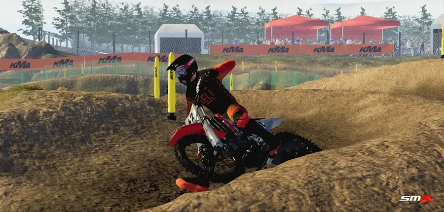 Mota de motocrosse a passar uma curva de terra batida no SMX: Supermoto Vs. Motocross
